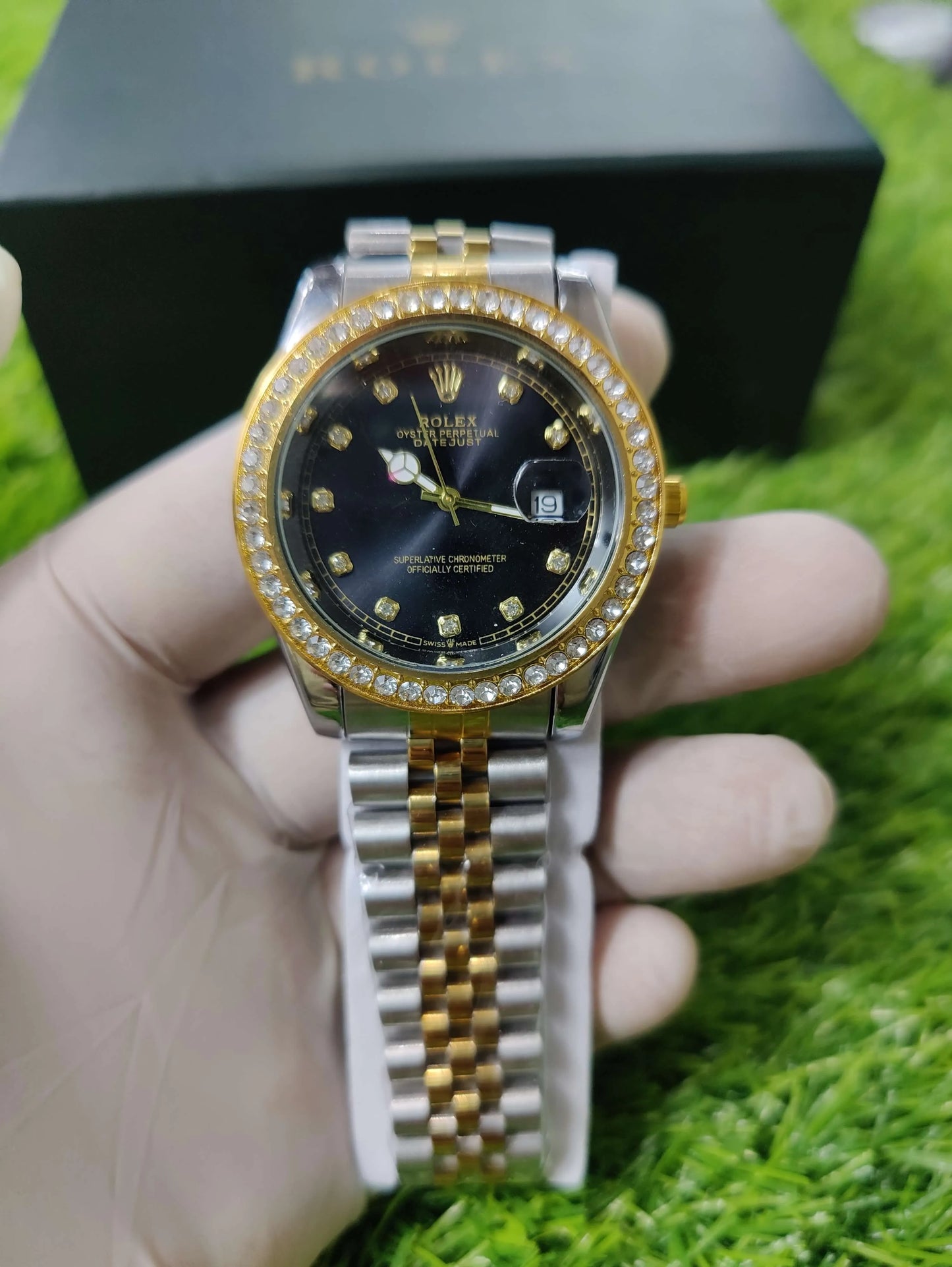 Rolex Oyster Perpetual Datejust with black dial and gold metal bracelet