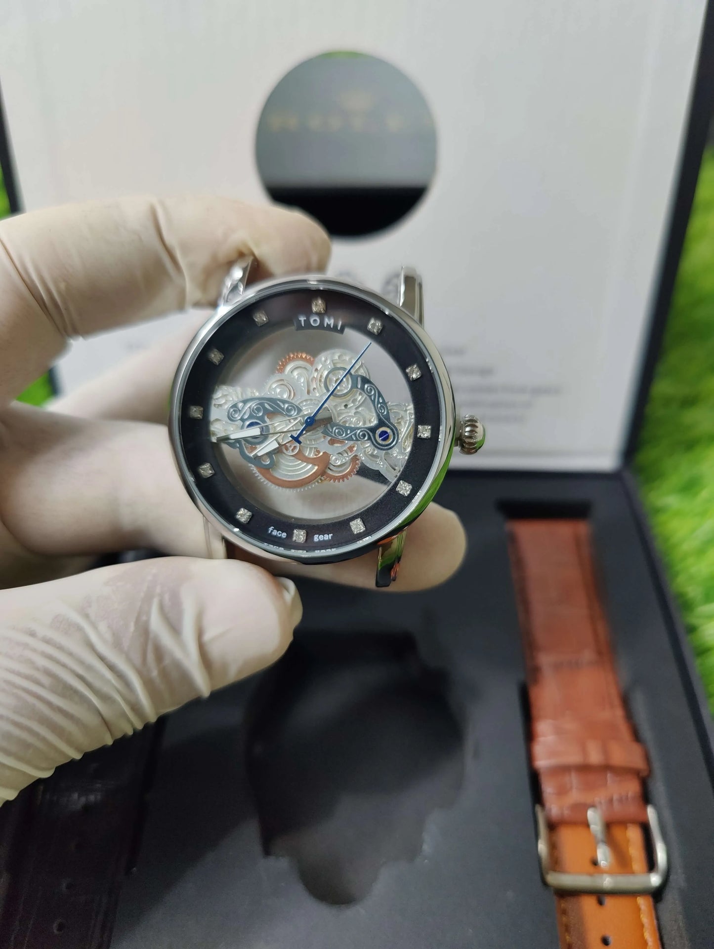 TOMI Face Gear dual strap watch with transparent dial and leather bands