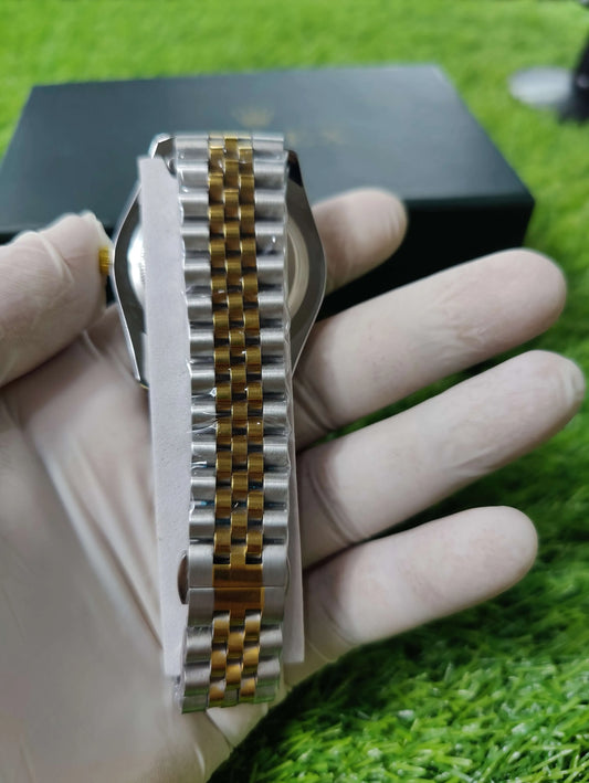 Blue dial Rolex Datejust with diamond hour markers and gold silver bracelet