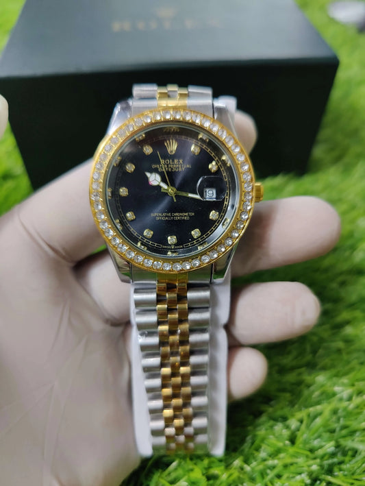 Rolex Oyster Perpetual Datejust with black dial and gold metal bracelet