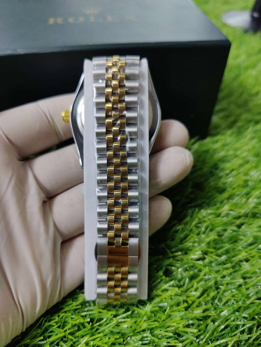 Silver dial Rolex Datejust with diamond markers and gold/silver bracelet