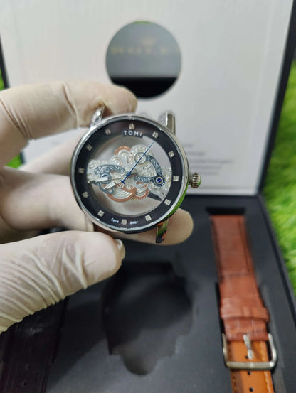 TOMI Face Gear dual strap watch with transparent dial and leather bands