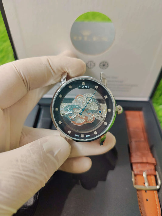 TOMI Face Gear dual strap watch with transparent dial and leather bands